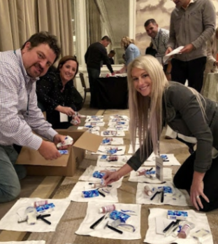 Corporate team assembles hygiene kits 